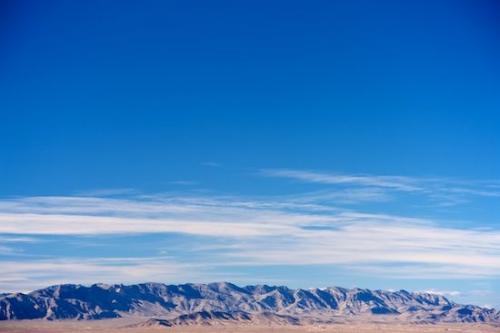 Mountains;Cloud;Nevada;Brown;Cloud Formation;Mountain;Mountain Top;Summit;Clouds;Landscape;Sky;Blue;Tan;Valley of Fire State Park;Desert;Weather;Pinnacle;White