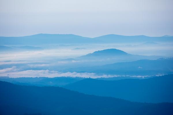 Blue;Blue Ridge Parkway;Calm;Cloud;Cloud Formation;Clouds;Concepts;Fog;Healing;Health care;Healthcare;Mist;Mountain;Mountain Side;Mountainous;Nature;North Carolina;Obscured;Oneness;Pastoral;Sunlight;Sunshine;United States;color;foggy;haze;landscape;mist;misty;morn;morning;peaceful;restful;serene;sky;soothing;sunlit;tranquil;zen