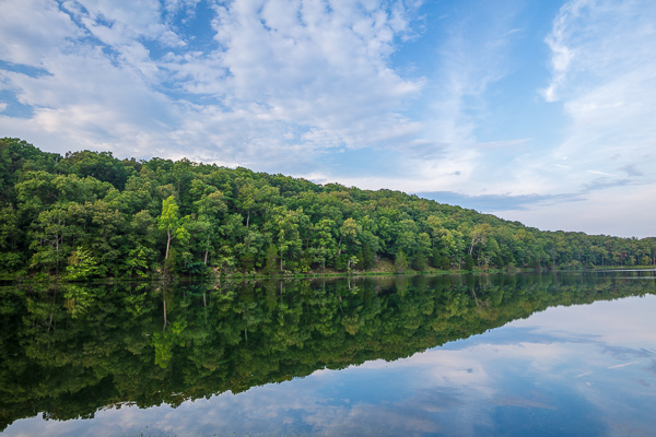 Blue;Branches;Calm;Cloud;Cloud Formation;Clouds;Concepts;Cool Colors;Cool Palette;Cool Tones;Forest;Forested;Green;Greens;Habitat;Healing;Health care;Healthcare;Leaves;Minimalism;Mirror;Montgomery Bell State Park;Nature;Oneness;Pastoral;State Park;Tennessee;Timber;Timberland;Tree;United States;Water;Waterscape;Wood;Woodland;Woods;color;hillside;lake;landscape;limbs;oneness;peaceful;plants;reflection;reflections;restful;serene;sky;soothing;tranquil;tree;tree limbs;trees;zen