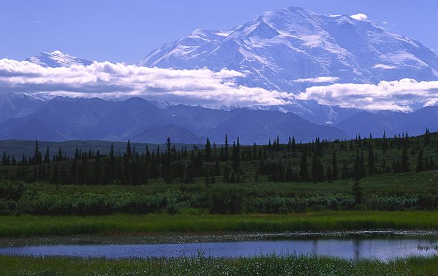 Ledge;Mountain;Cliff;Precipice;Peak;Mountain Top;Rock Formations;Rocks;Boulder;Nature;Vertical;High;Power;Powerful;Scenic View;Scenics;Summit;Clouds;Sky;Water;Lake;Pond;Body of Water;Wet;Cool;Deep;Clear;Pool;Reservoir