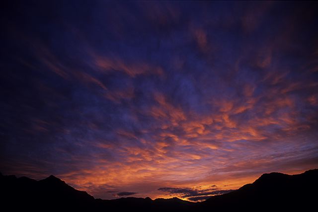 Sunlight;Sun;Beams;Sunbeam;Rays;Light;Luminance;Illuminate;Sunset;Dusk;Twilight;evening;Nightfall;Sundown;Ledge;Mountain;Cliff;Precipice;Peak;Mountain Top;Rock Formations;Rocks;Boulder;Nature;Vertical;High;Power;Powerful;Scenic View;Scenics;Summit