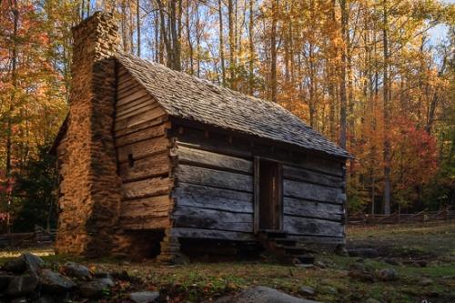 Architecture;Blue;Brown;Cabin;Chimney;Forest;Forested;Gold;Great Smoky Mountains;Log Cabin;Stone;Sun rays;Sunlight;Sunshine;Tan;Timber;Timberland;Tree;Wood;Woodland;Woodlands;Woods;Yellow;doorway;green;leaves;log;oneness;orange;peaceful;red;restful;sunlit;tranquil;trees;zen