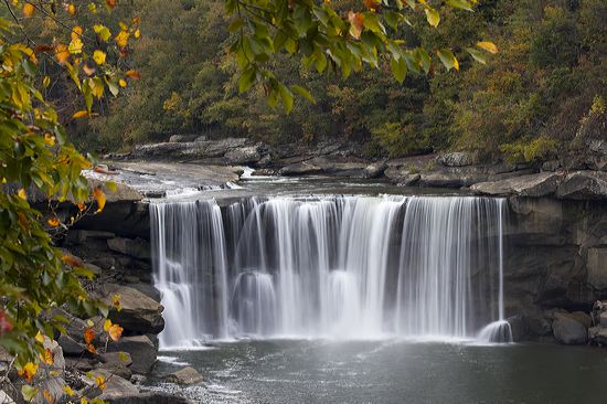 Cliff;Rock Face;Sheer;Steep;Waterfall;Stream;Water;Flowing;Pouring;Cool;Wet;Flow;Cascade;Cascading;Spray;Cataract;Falls;Chute;Falling;Spilling;Rocks;Rock;Boulder;Boulders;Rock Formations;Stones;Pebble;Pebbles;Stone