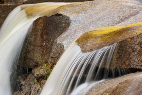 Reflections;Outdoor;Rocks;Waterfall;Brown;Waterfalls;Gold;Boulders;New Hampshire;Stones;Water;Falls;Reflection;Boulder;Rock Face;Rock;Cascade;Cascading;Rock Formations;Stone;Pouring;Tan;Streaming;New England;Close-up;Yellow;Chute
