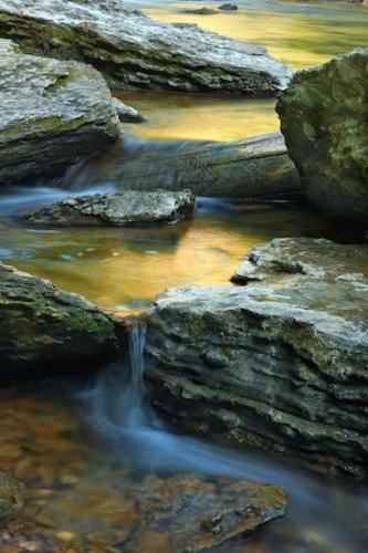 Cummins Falls;Gold;Rocks;Reflections;Waterfalls;Falls;Boulders;Blue;Rock Formations;Reflection;Water;Gray;Boulder;Brown;Streaming;Rock;Chute;Cascading;Stones;Pouring;Stone;Stream;Waterfall;Cascade