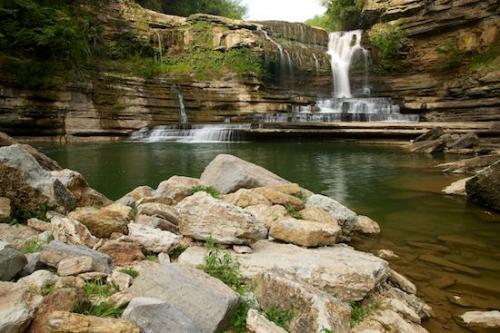Rocks;Pouring;Stones;Boulders;Brown;Waterfalls;Rock Face;Rocky;Cascade;Chute;Rock;Water;Cascading;Boulder;Tan;Rock Formations;Green;Stone;Falls;Cummins Falls;Waterfall;Stream;Streaming