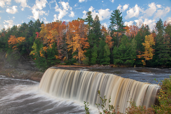 Autumn;Blue;Brown;Calm;Cascade;Cascading;Chute;Cloud;Cloud Formation;Clouds;Cloudy;Creek;Fall;Falls;Flow;Forest;Forested;Gold;Great Lakes;Healing;Michigan;Nature;Pastoral;Pouring;River;Spilling;Stream;Streaming;Tahquamenon Falls;Tan;Timber;Timberland;Tree;United States;Upper Peninsular;Water;Waterfalls;Waterscape;Wood;Woodland;Woods;Yellow;flowing;green;landscape;leaves;oneness;orange;peaceful;rapids;restful;river bank;serene;sky;soothing;tranquil;trees;waterfall;zen