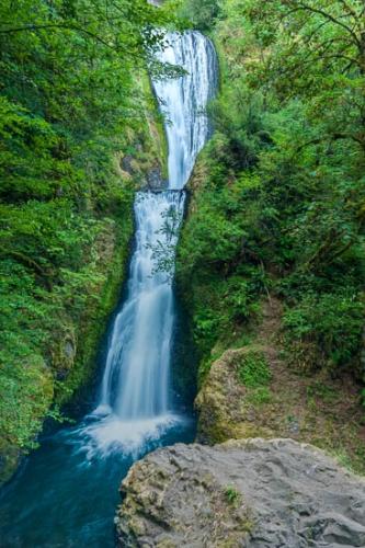 Blue;Boulder;Boulders;Brown;Cascade;Cascading;Chute;Falling;Falls;Flow;Forest;Green;Pouring;Rock Formations;Rocks;Spilling;Stream;Tan;Trees;Water;Waterfall;Wet;flowing