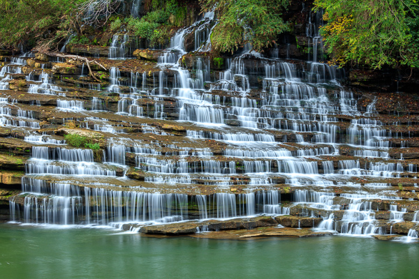 Branches;Brown;Calm;Cascade;Chute;Concepts;Cool Colors;Cool Palette;Cool Tones;Falls;Flow;Green;Greens;Healing;Health care;Healthcare;Leaves;Nature;Oneness;Pastoral;Pouring;Rock;Rock Island State Park;Rock formations;Rocks;Rocky;State Park;Stone;Stones;Streaming;Tan;Tennessee;Tree;United States;Water;Waterfalls;Waterscape;color;flowing;landscape;limbs;peaceful;plants;restful;serene;soothing;tranquil;tree;tree limbs;trees;waterfall;zen
